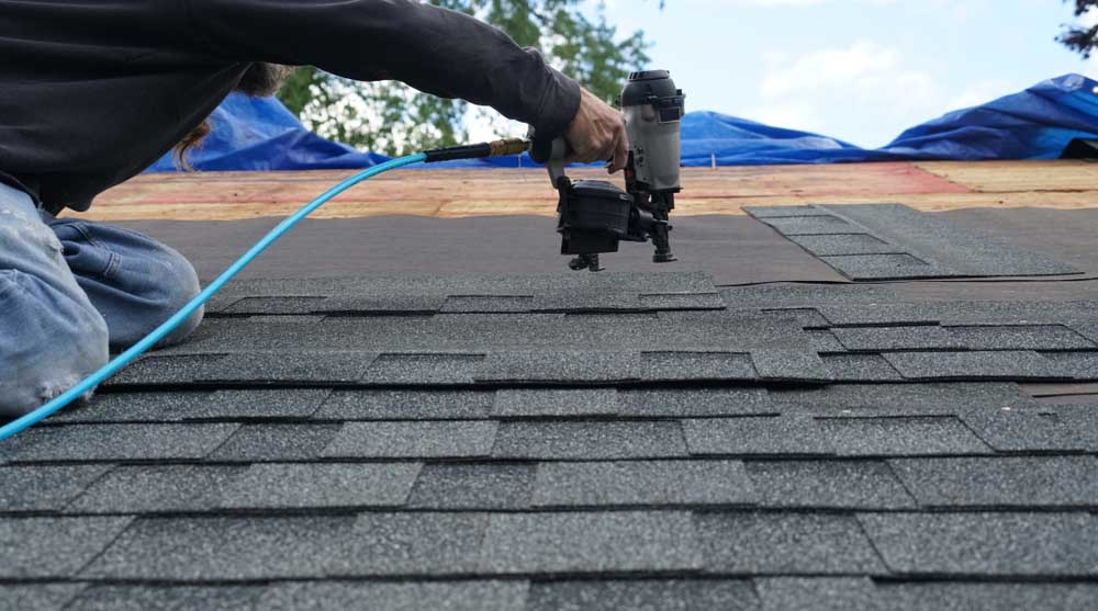 roofer repairing shingle roof Hendersonville, NC