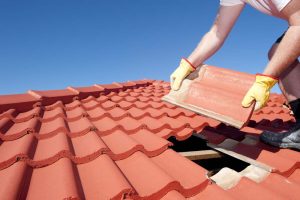Secure Roofing technician working on roof replacement