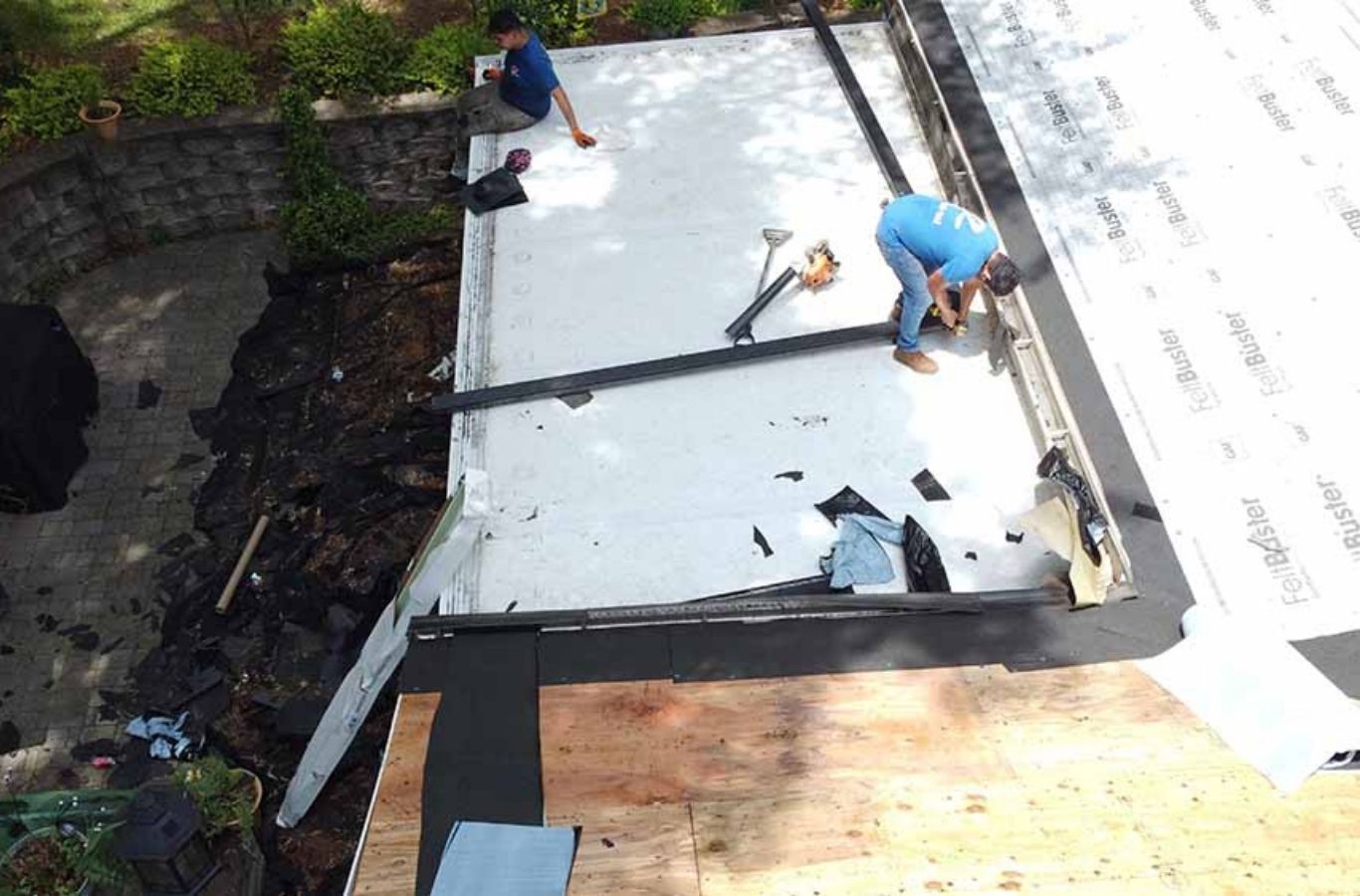 Secure Roofing crew replacing a roof in Brevard, NC, showing the advantages of hiring skilled local roofing specialists.