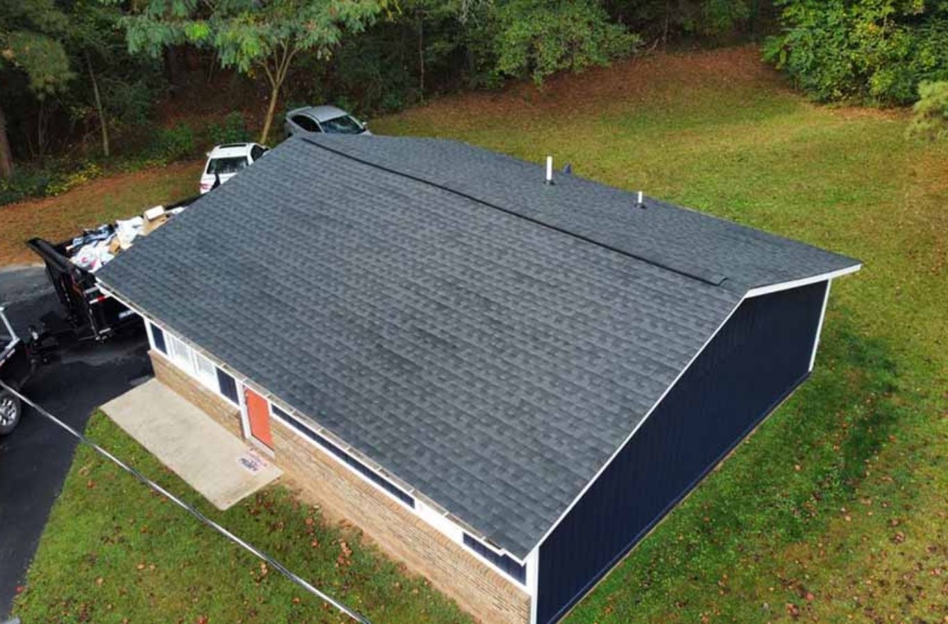 Benefits of Roof Replacement in Greenville, NC by Secure Roofing Secure Roofing crew performing roof replacement in Greenville, NC, showing the benefits of hiring skilled and reliable local roofing experts.