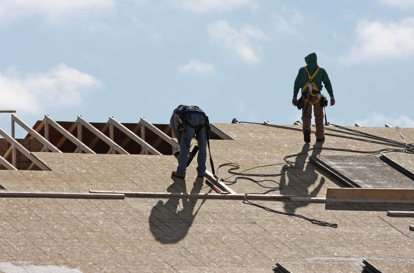 Secure Roofing technician installing commercial roofing in Fletcher, NC using advanced tools for durable and precise results.
