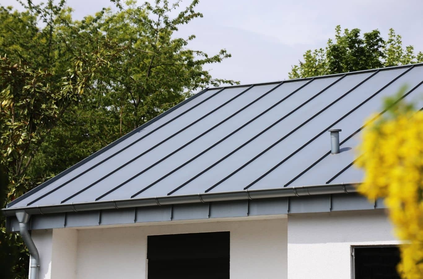 Secure Roofing technician installing metal roofing in Hendersonville, NC using professional tools for durable and precise results.