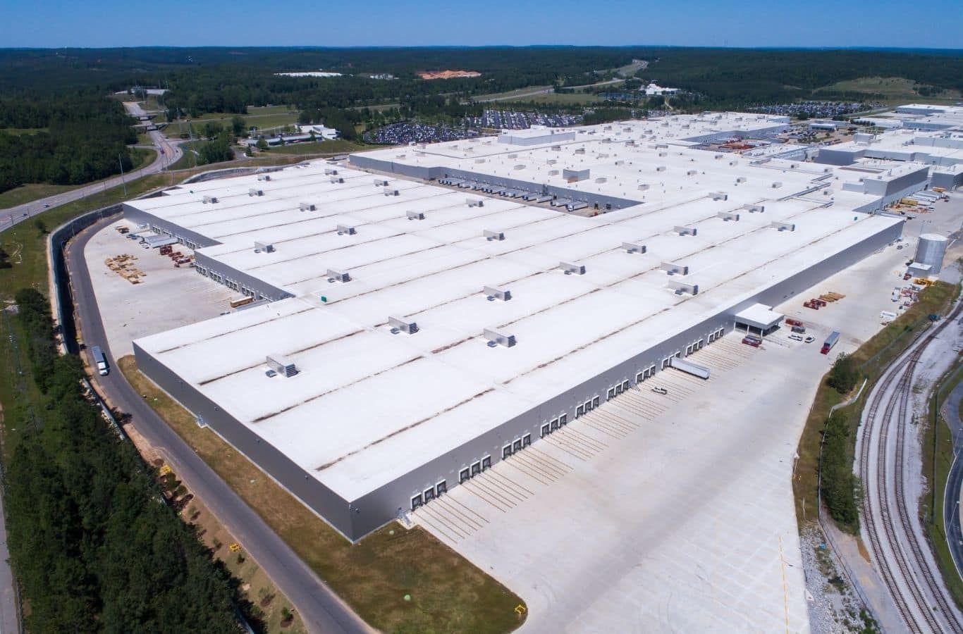 Secure Roofing crew installing TPO roofing in Arden, NC to improve long-term protection for low-slope commercial roofs.