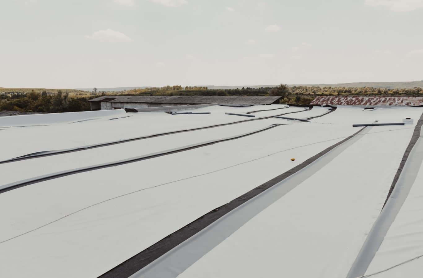 Secure Roofing technician installing TPO roofing in Arden, NC using professional equipment for durable commercial protection.