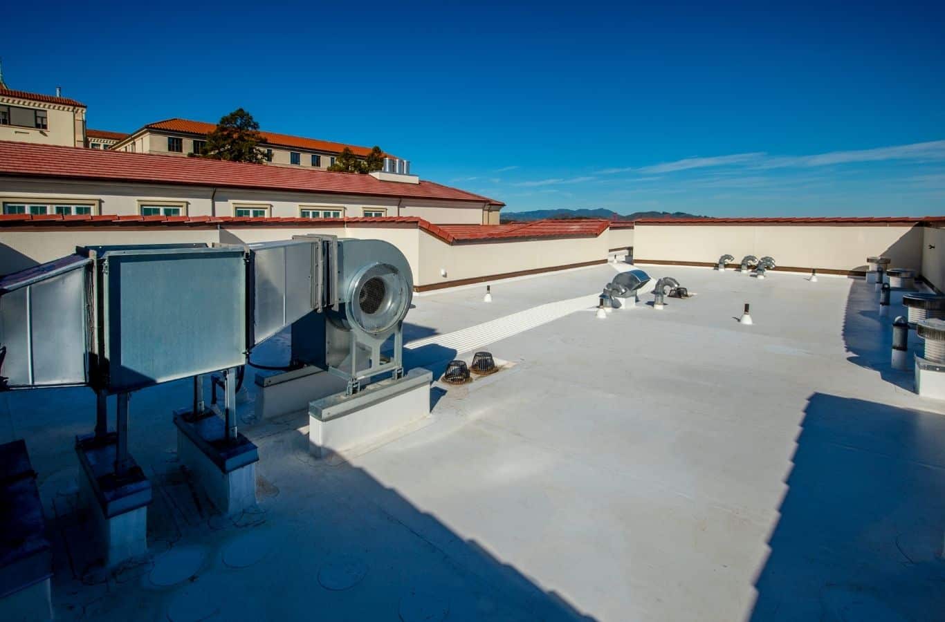 Secure Roofing specialist installs TPO roofing in Lake Lure, NC using professional tools for precise roof coverage.